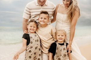 Oahu Family Photographer captures a family at sunset in Hawaii.