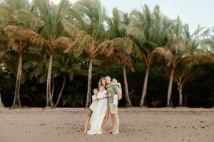 Oahu Family Photographer captures a family at sunset in Hawaii.