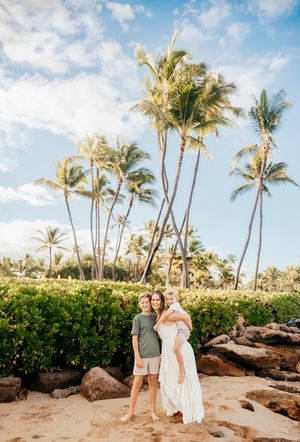 Oahu Family Photographer captures a family at sunset in Hawaii.