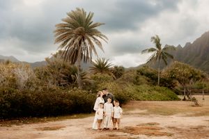 Oahu Family Photographer captures a family at sunset in Hawaii.