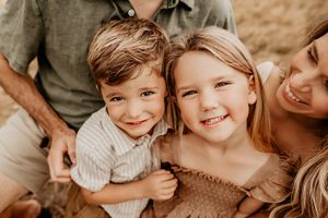 Oahu Family Photographer captures a family at sunset in Hawaii.