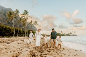 Oahu Family Photographer captures a family at sunset in Hawaii.