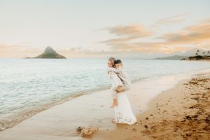 Oahu Family Photographer captures a family at Chinaman's Hat in Hawaii.