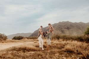 Oahu Family Photographer captures a family at sunset in Hawaii.