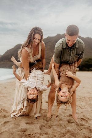 Oahu Family Photographer captures a family at sunset in Hawaii.