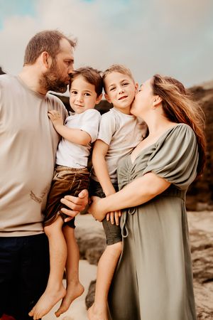 Oahu Family Photographer captures a family at sunset in Hawaii.