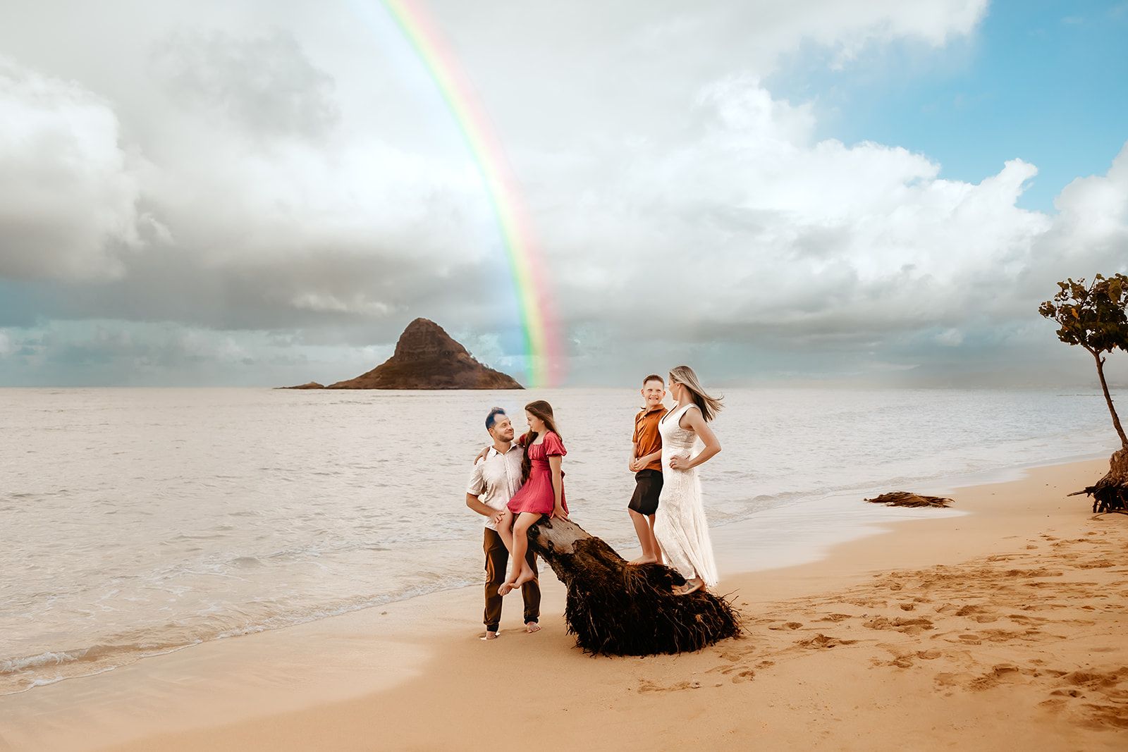 Oahu Family Photographer captures a family at Kualoa Regional Park in Hawaii.