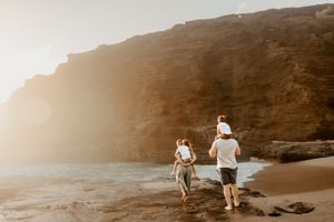 Oahu Family Photographer captures a family at sunset in Hawaii.