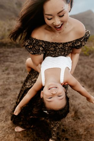 Oahu Family Photographer captures a family at sunset in Hawaii.