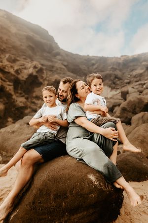 Oahu Family Photographer captures a family at sunset in Hawaii.