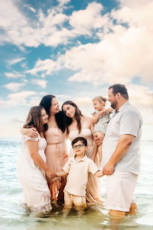 Oahu Family Photographer captures a family at sunset in Hawaii.