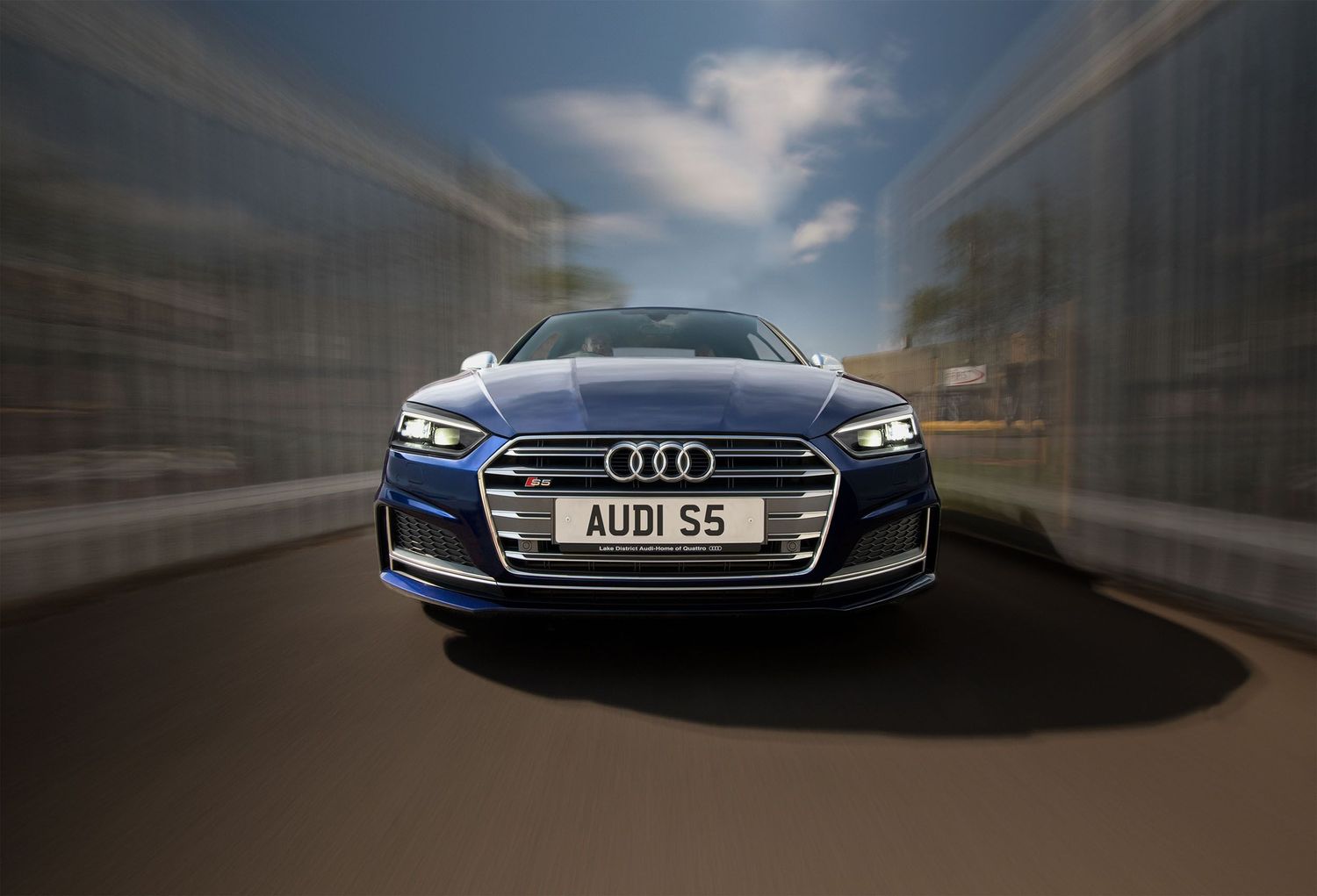 A 'rolling' photograph of an Audi S5 car.