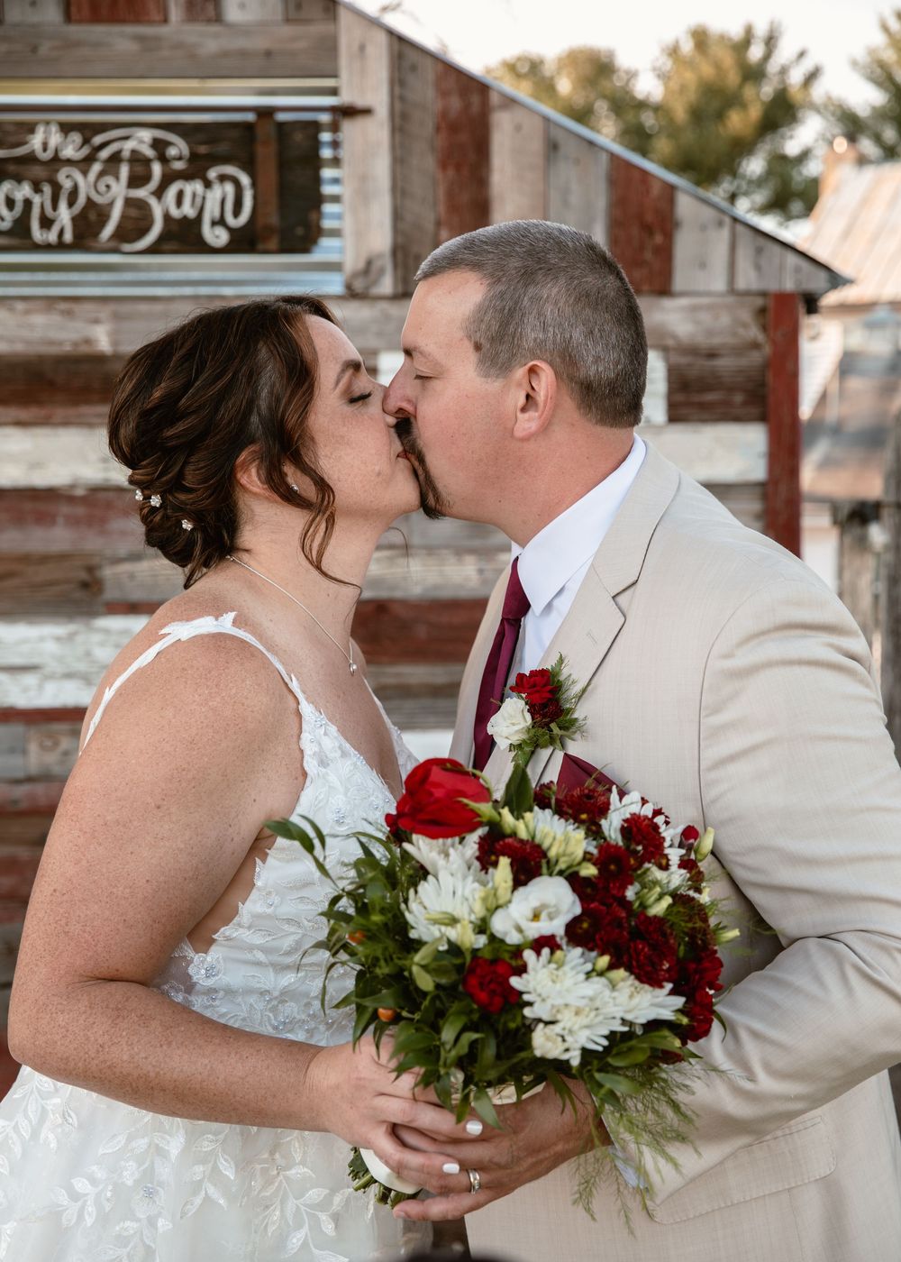 A series of romantic wedding photos showing tender moments between newlyweds with red and white floral bouquets.