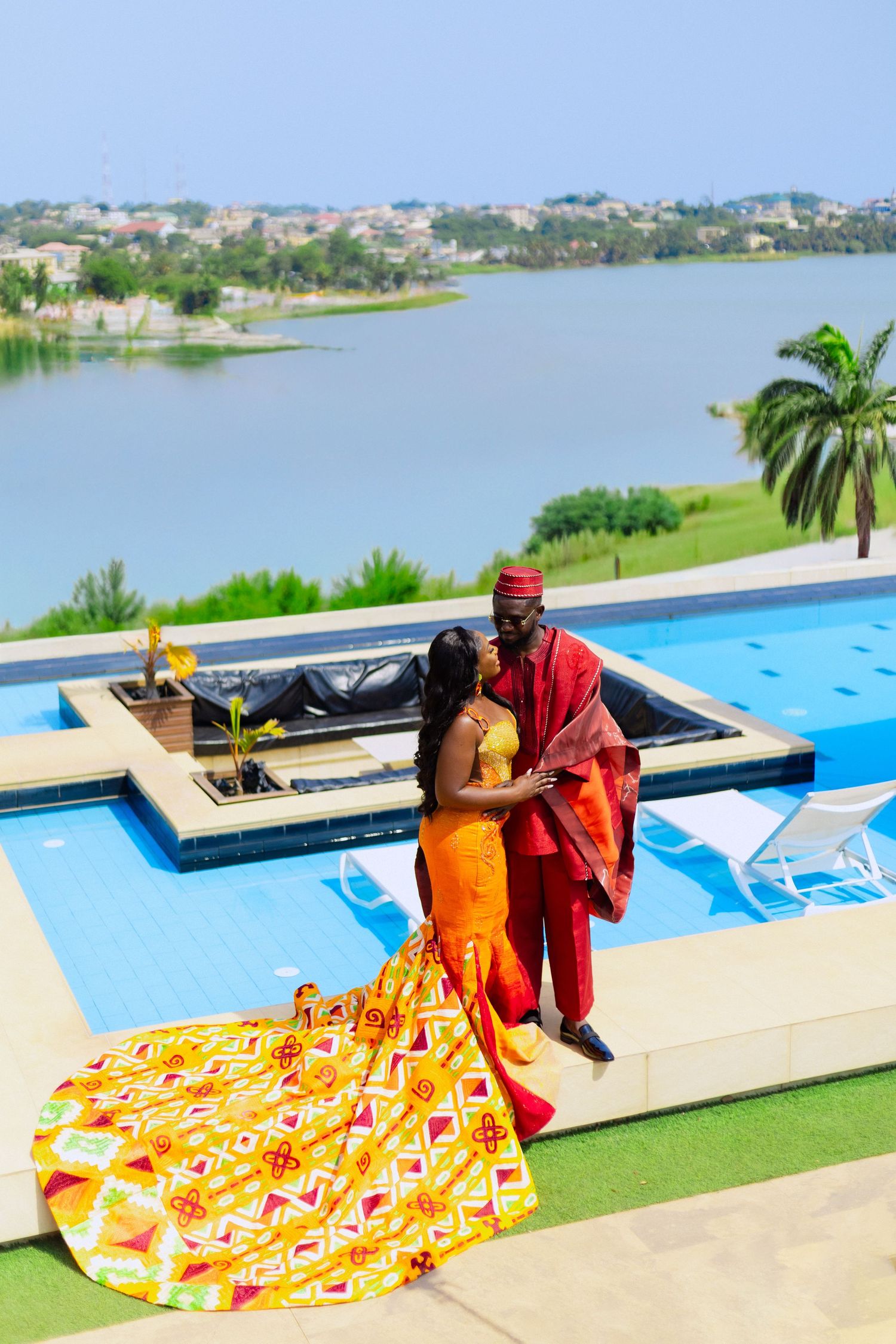 A series of photos showing someone arranging a vibrant orange and yellow patterned blanket by a rooftop swimming pool.