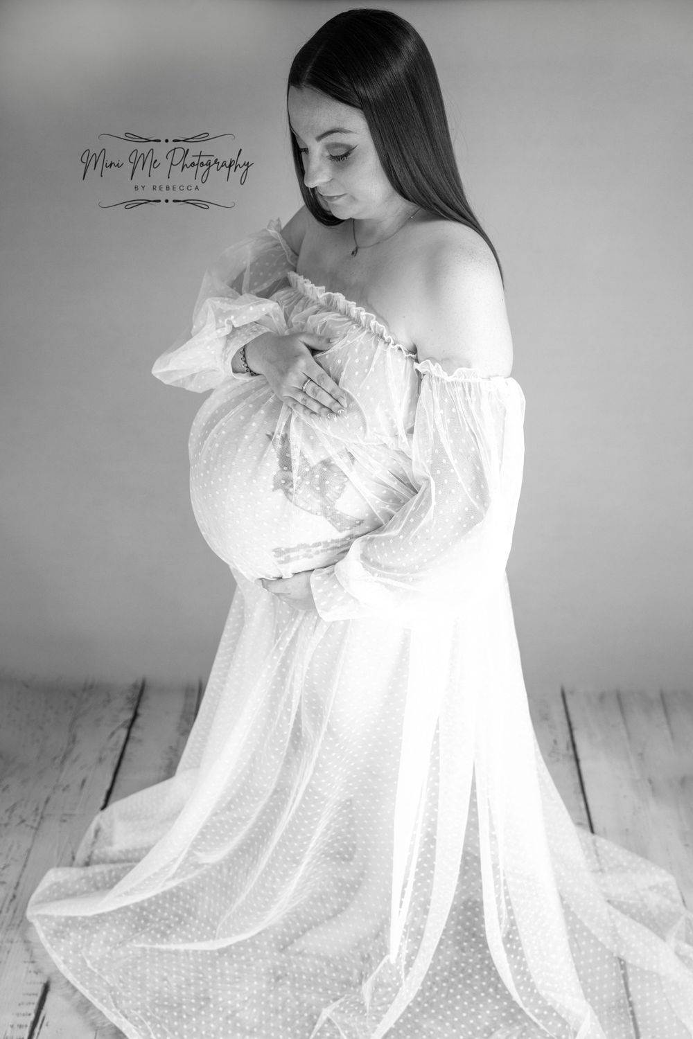 Professional Maternity photoshoot white dress looking down
