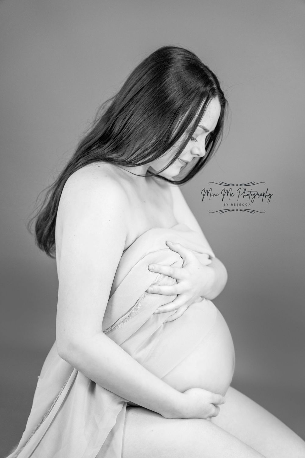 Professional Maternity photoshoot looking down at baby