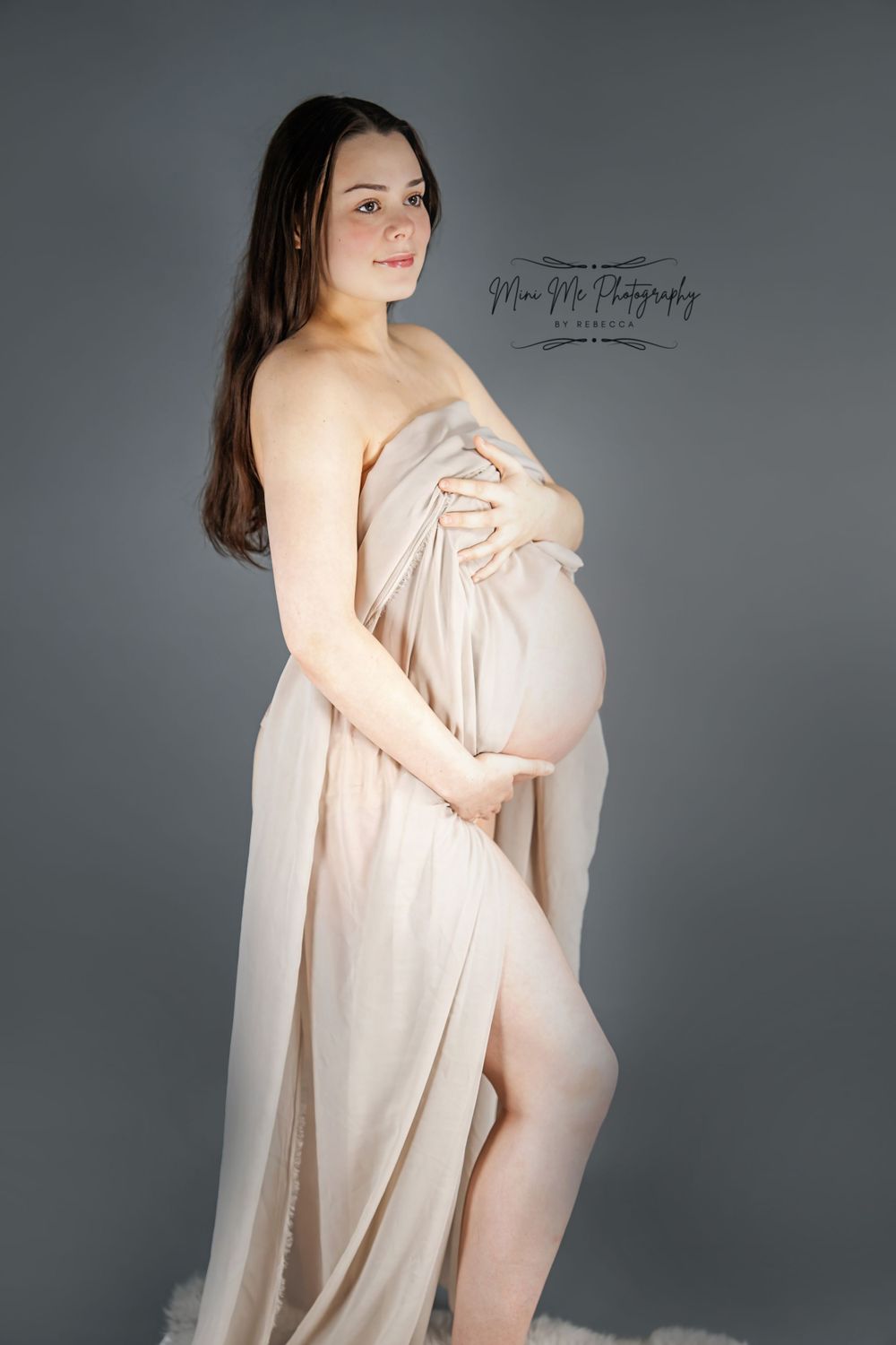 Professional Maternity photoshoot standing with fabric