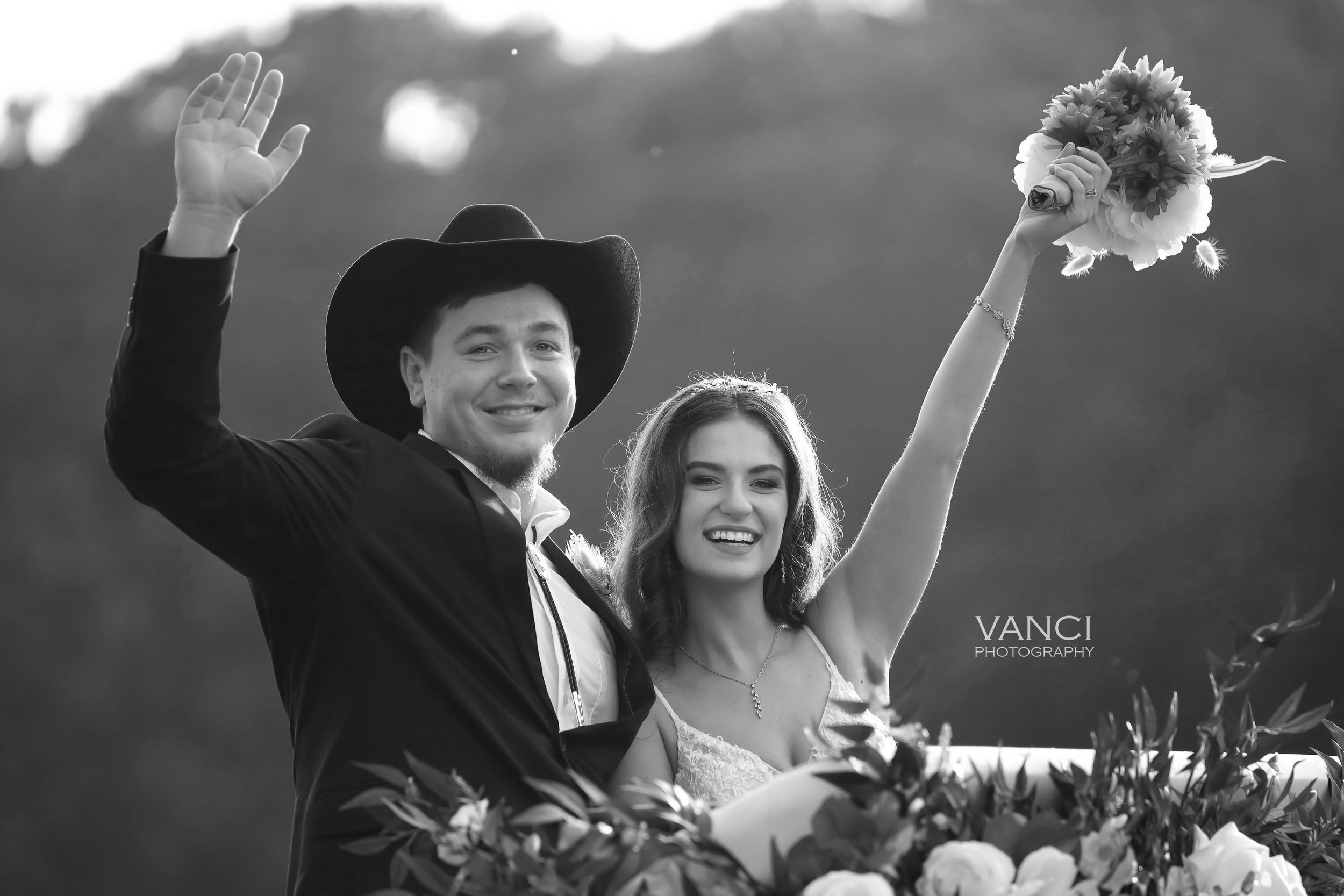 Black and white wedding photos show joyous moments with couples and guests celebrating at a reception event.
