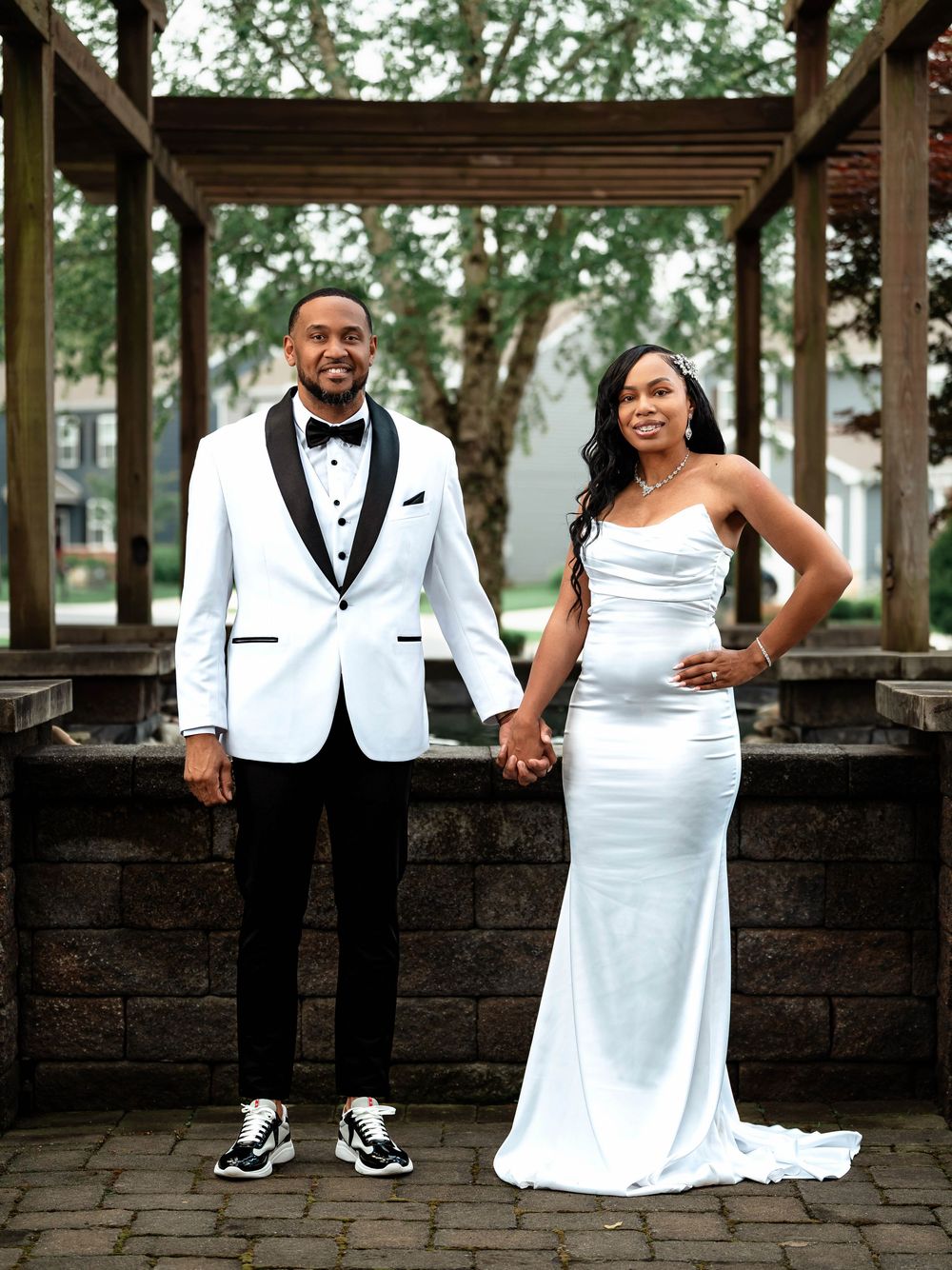Creative wedding party photo sequence showing couple and attendants in black and white attire split across multiple frames.