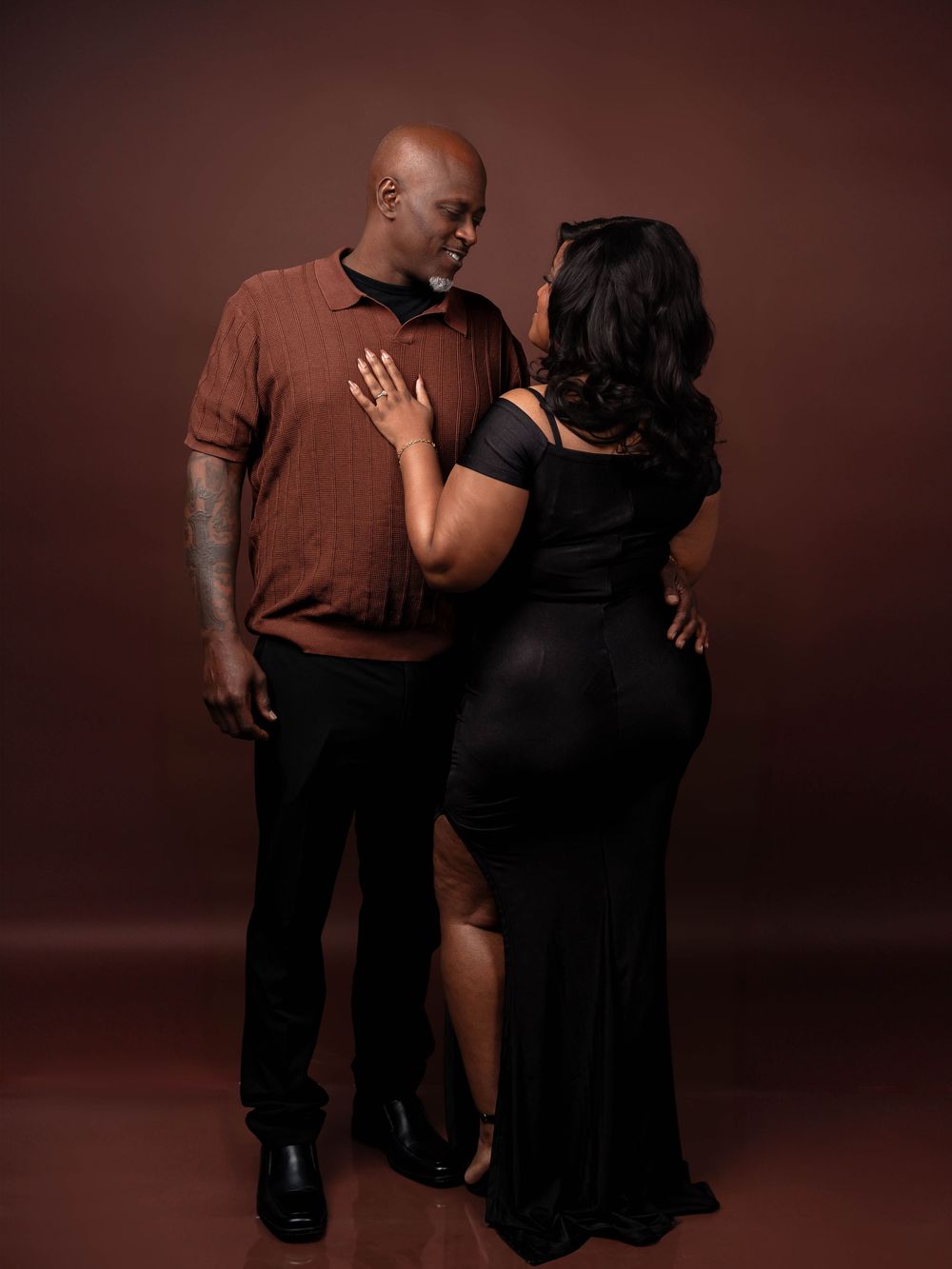 A series of four artistic studio portraits showing a couple in brown and black attire against a dark background.