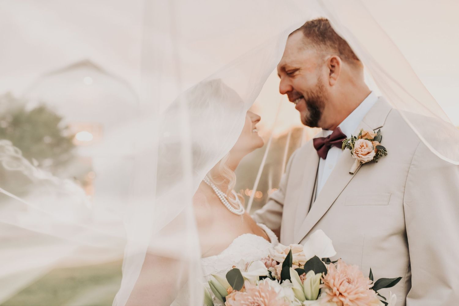 Fall wedding at The White Sparrow featuring romantic neutral colors and golden sunset light