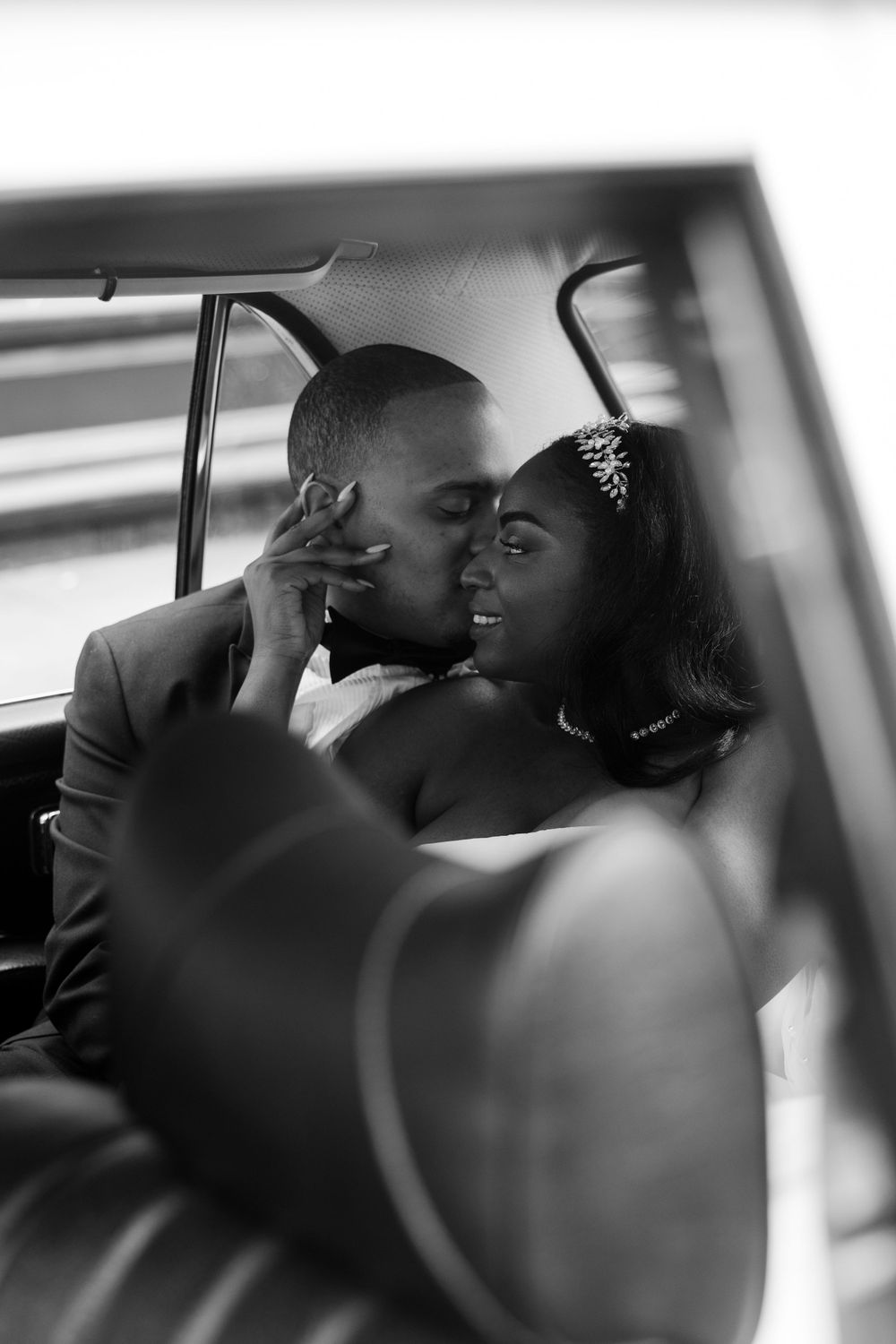 black and white photos of couple sitting in the back of a car on their san francisco elopement day