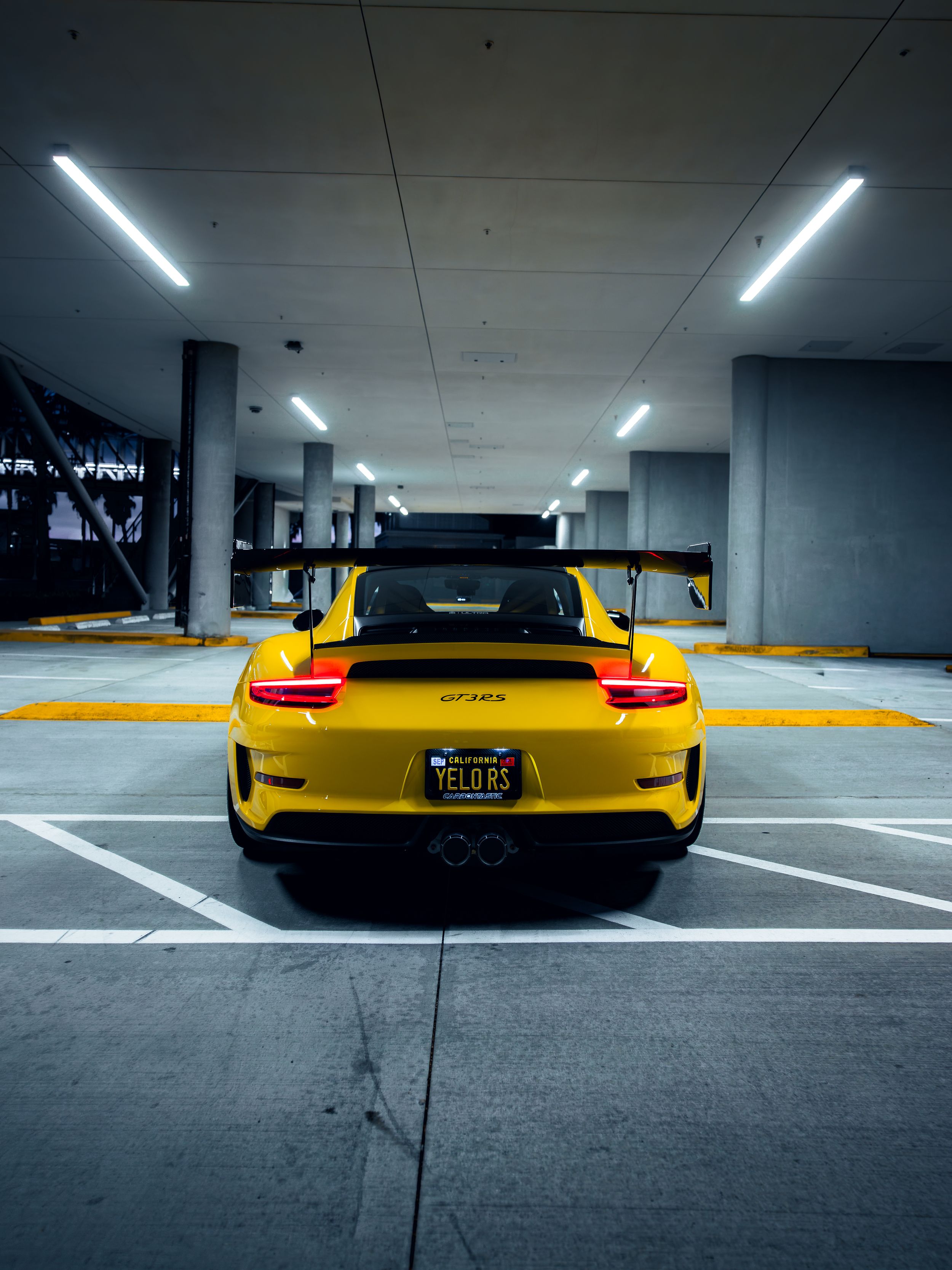 Racing yellow Porsche 991.2 GT3RS at night