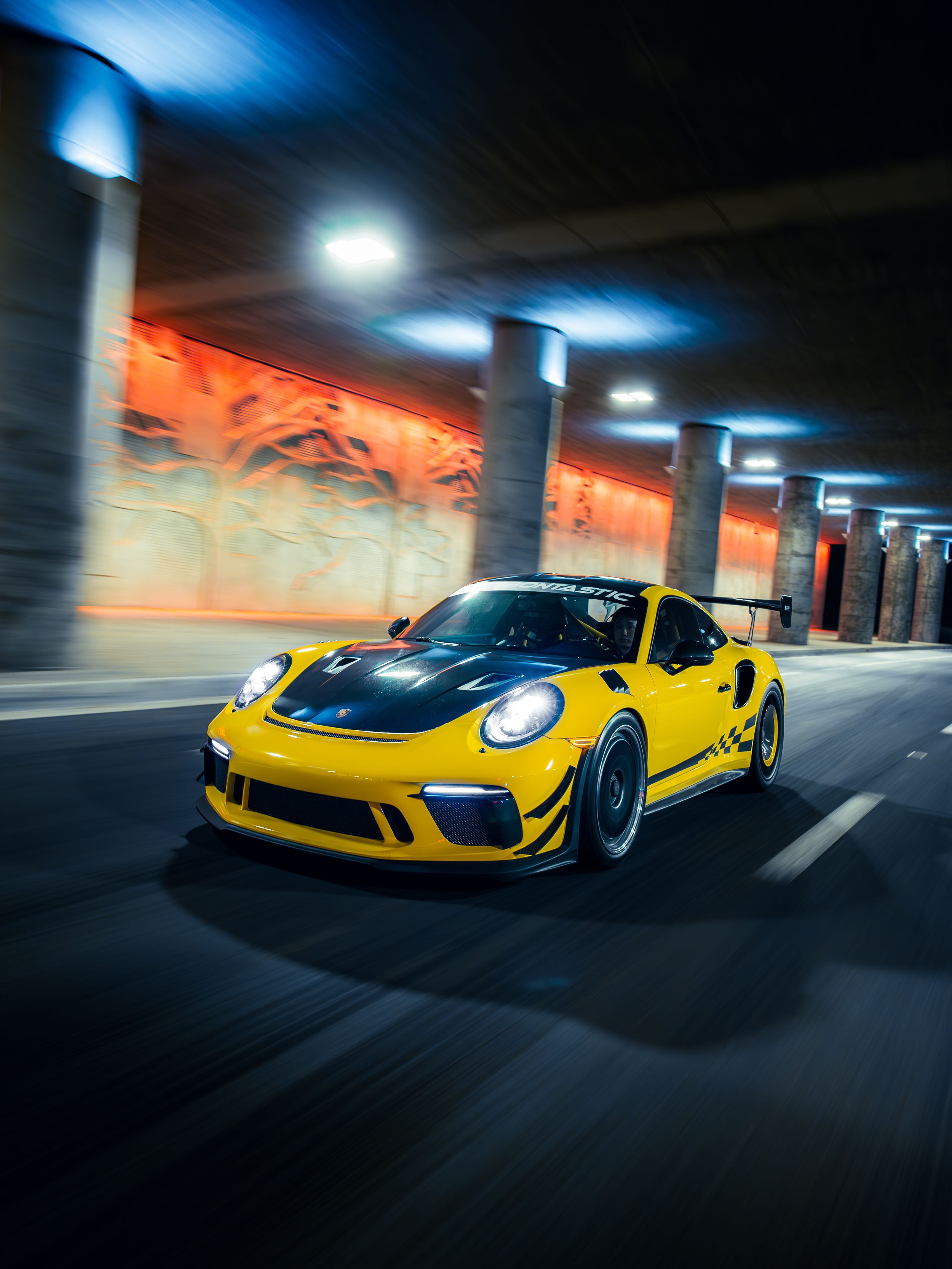 Racing yellow Porsche 991.2 GT3RS at night