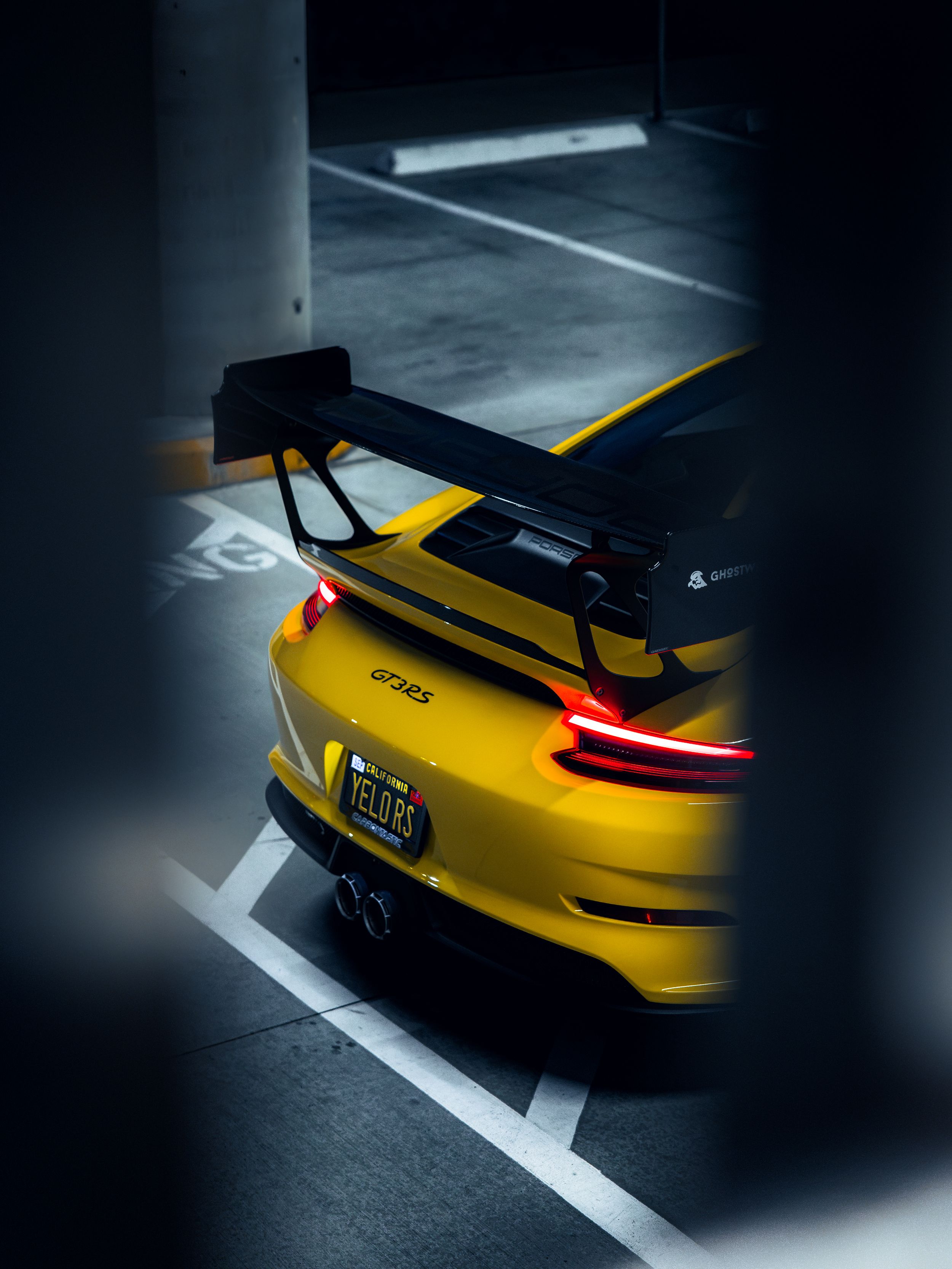 Racing yellow Porsche 991.2 GT3RS at night
