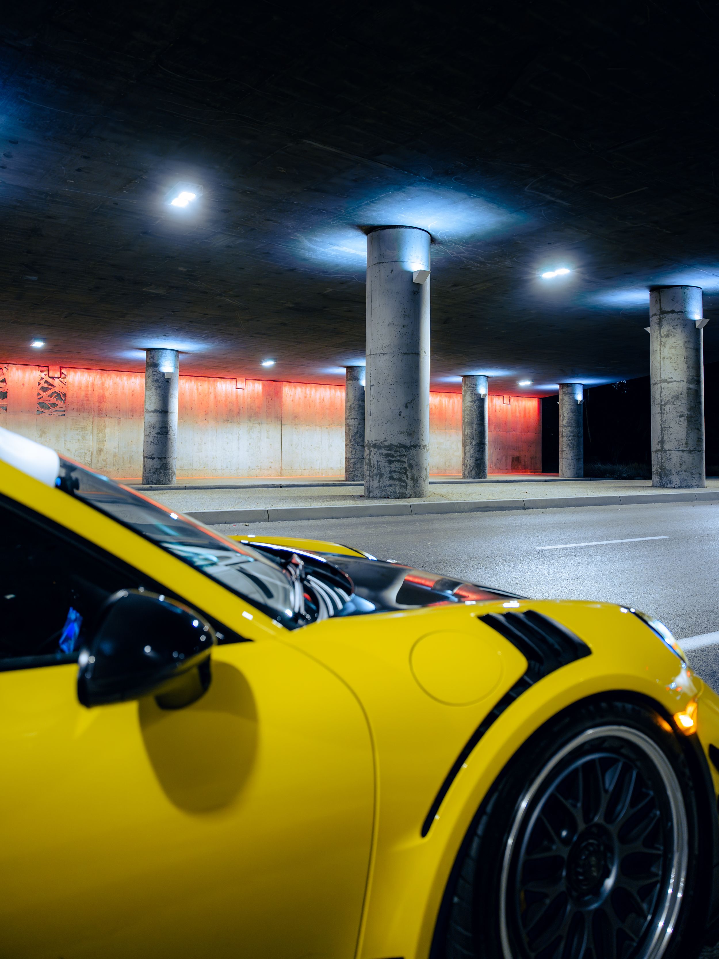 Racing yellow Porsche 991.2 GT3RS at night