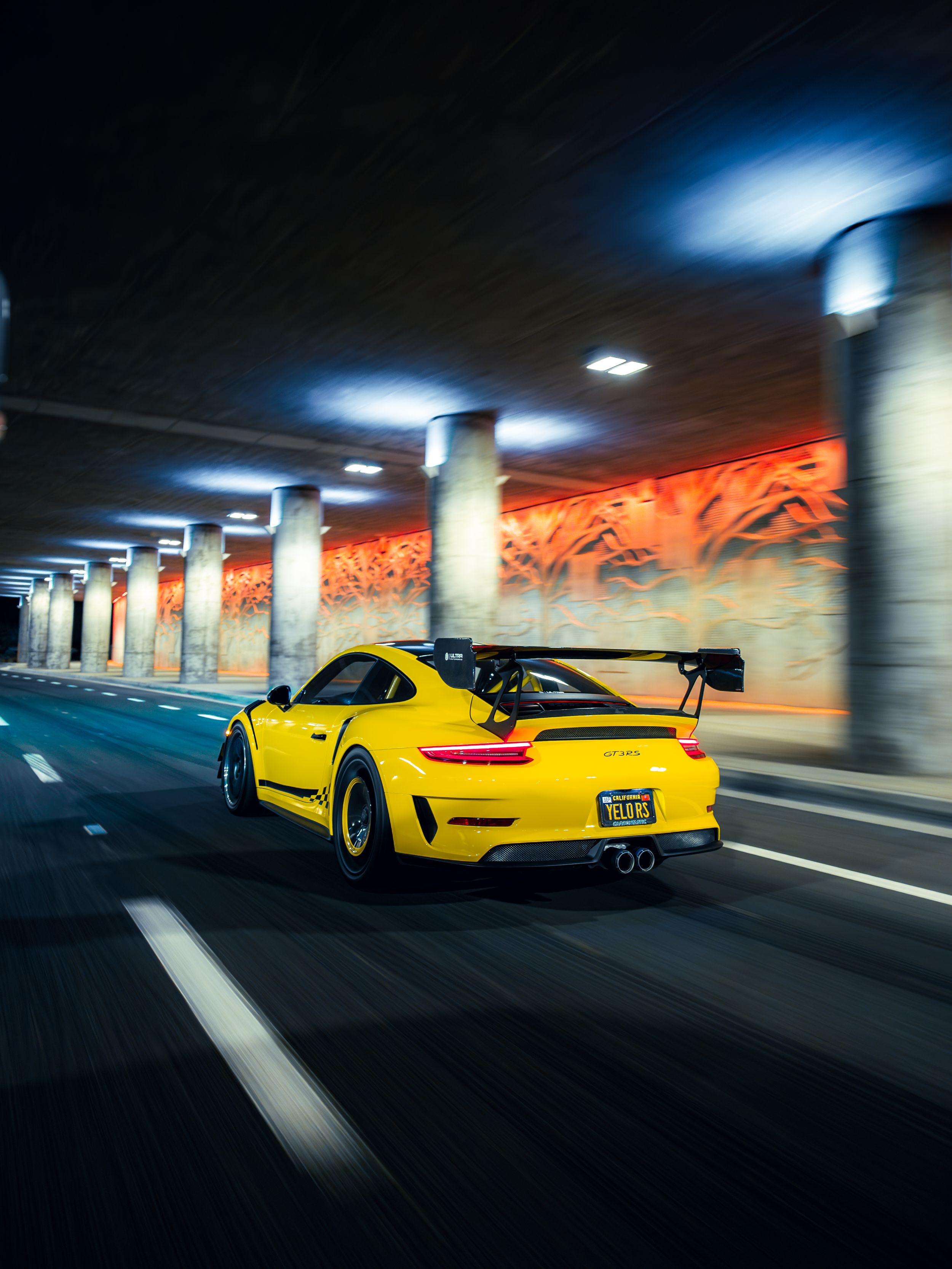 Racing yellow Porsche 991.2 GT3RS at night