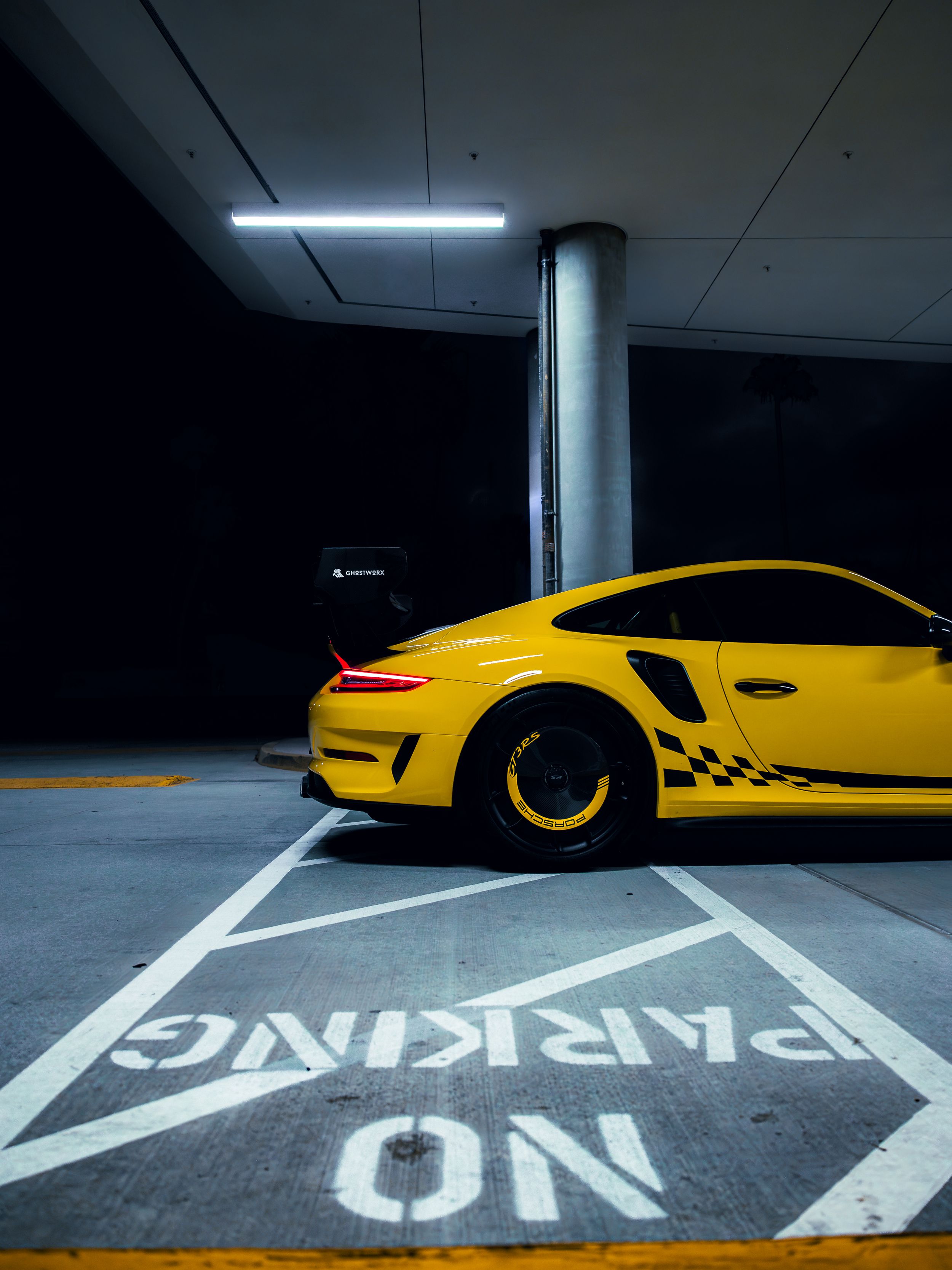 Racing yellow Porsche 991.2 GT3RS at night
