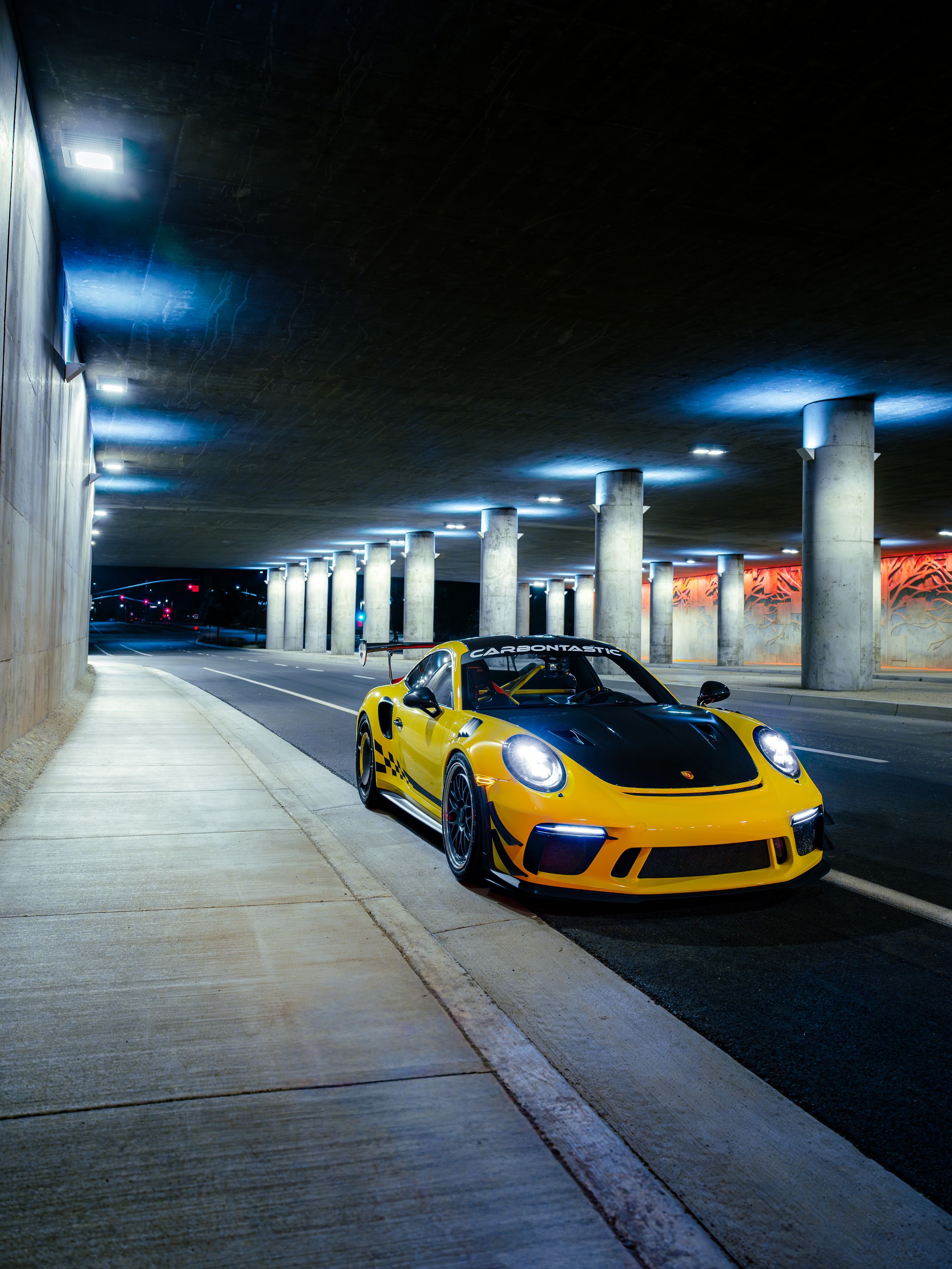 Racing yellow Porsche 991.2 GT3RS at night