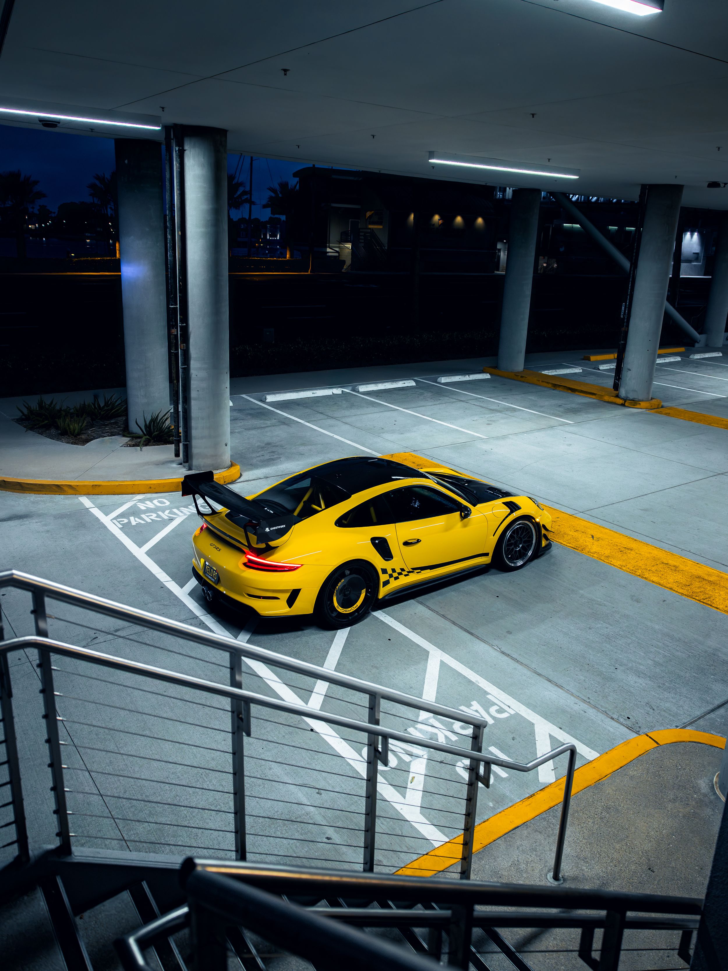 Racing yellow Porsche 991.2 GT3RS at night