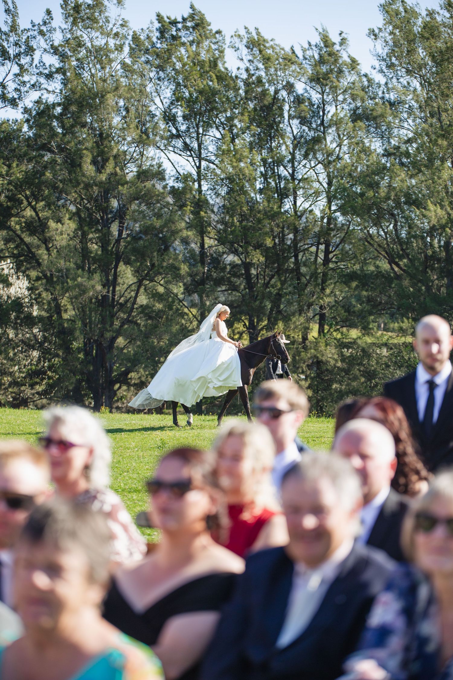 Bride Jess arriving on her horse Jett for her Dungog wedding ceremony
