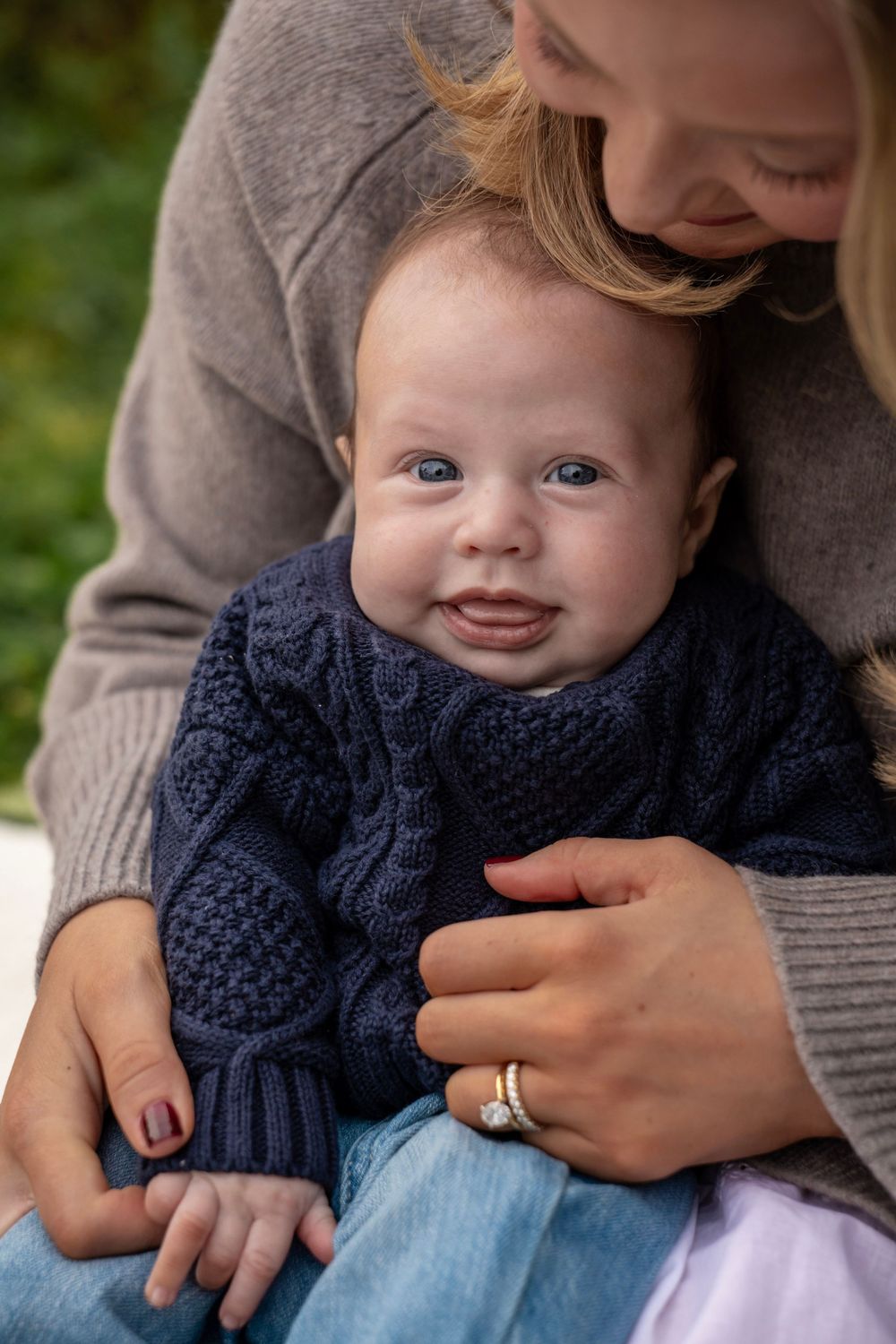 Mom and baby smiling in a candid photo
