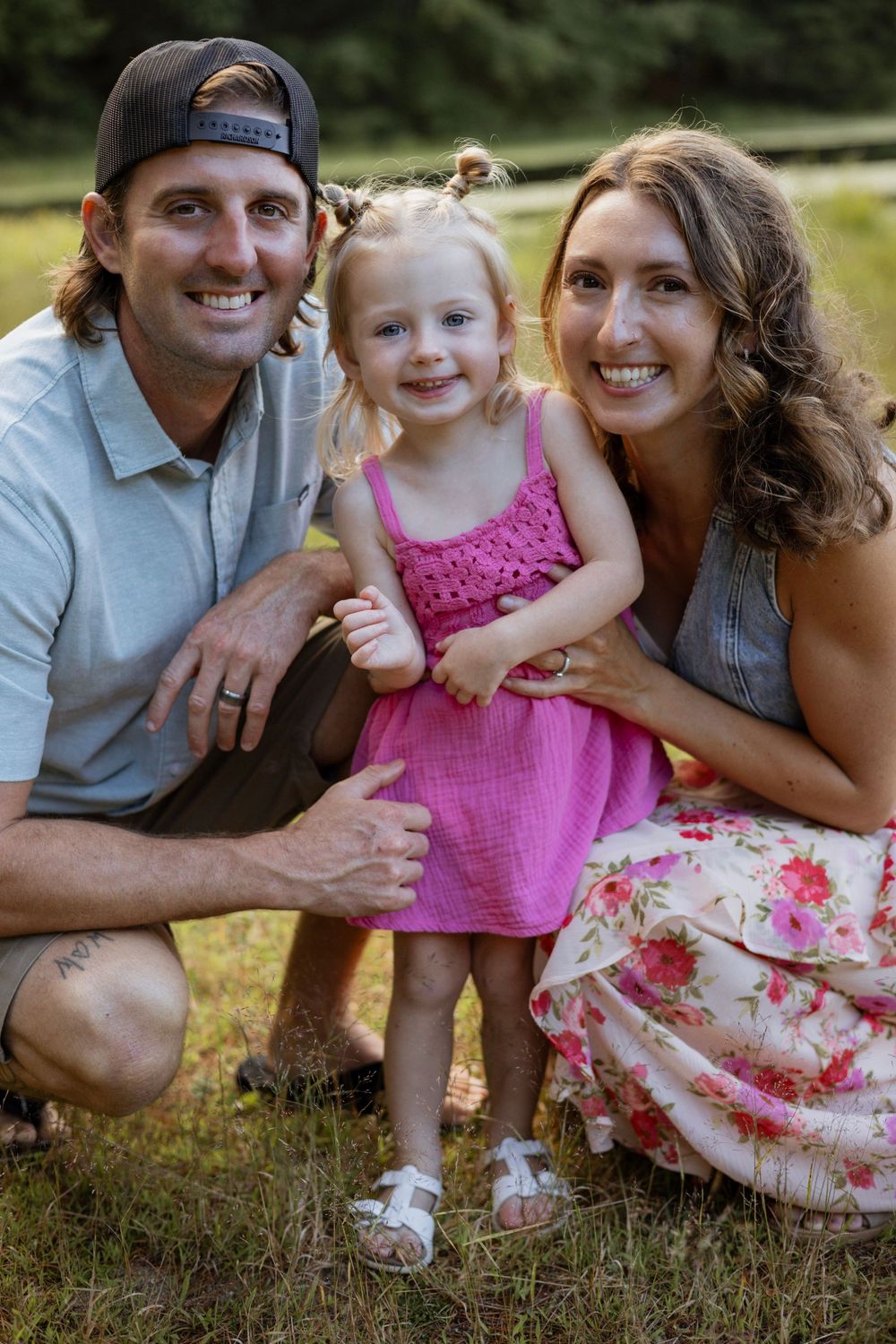 Family smiling during a golden hour photo session