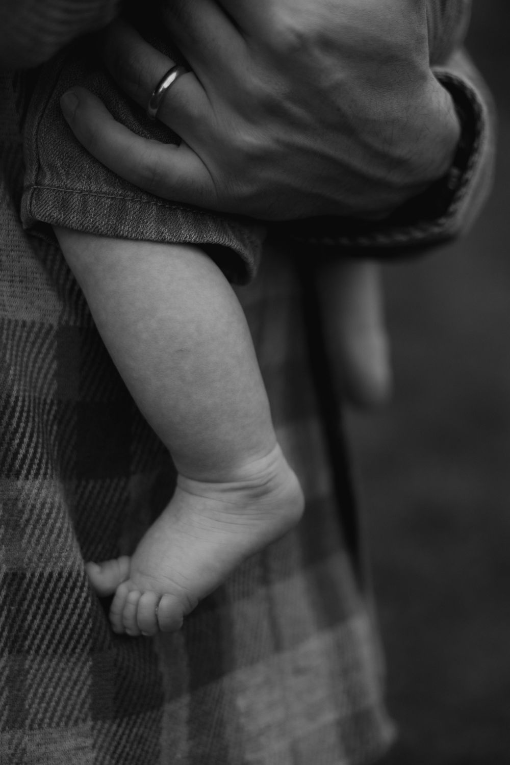 Detail photo of dad holding baby