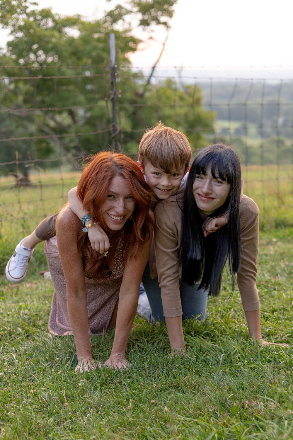 Family having fun in a field during an outdoor session