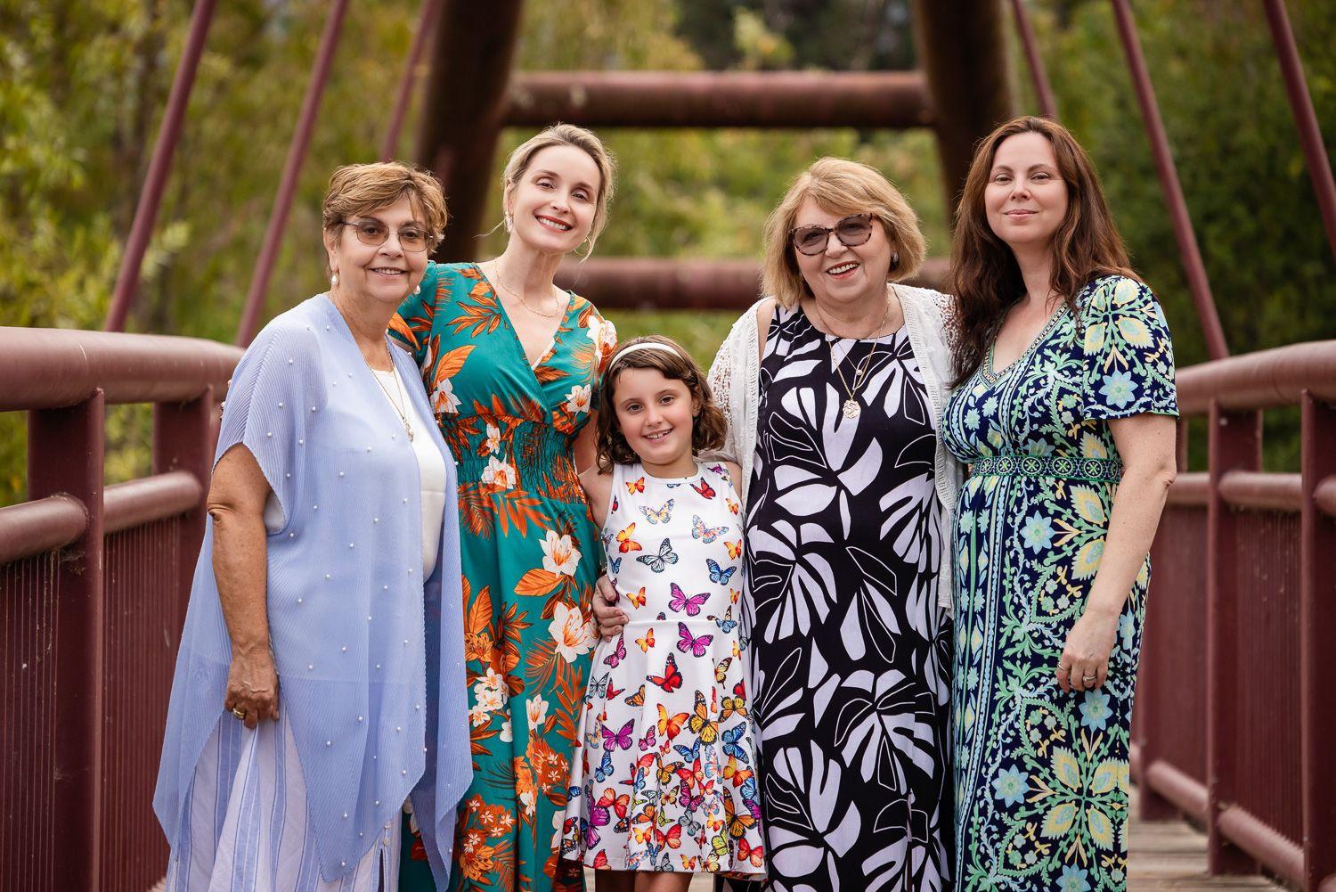 A Bay Area Family poses on the red bridge in Los Gatos