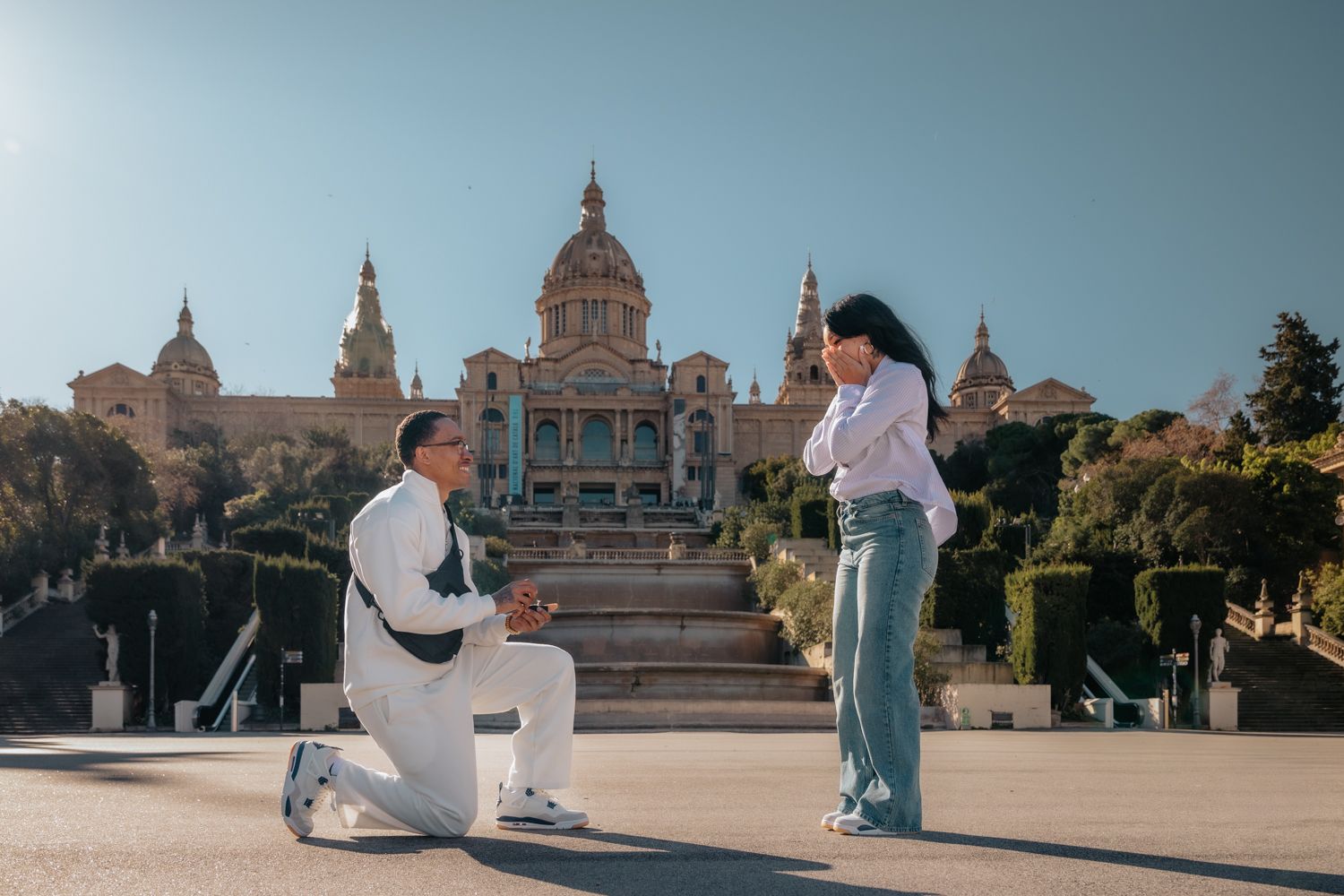 A private and intimate surprise proposal on a peaceful stone terrace overlooking the sweeping city skyline from Montjuïc, Barcelona.