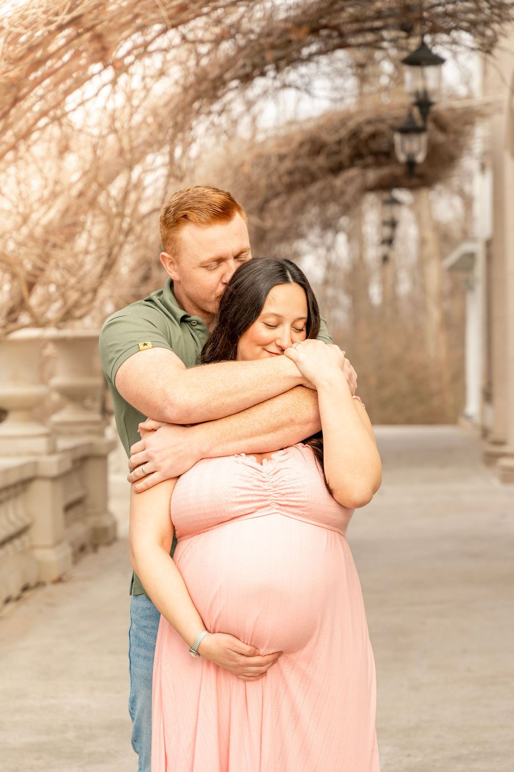 Maternity photoshoot at the Liriodendron mansion in Bel Air MD. Mom and Dad to-be embraced in the warm morning glow