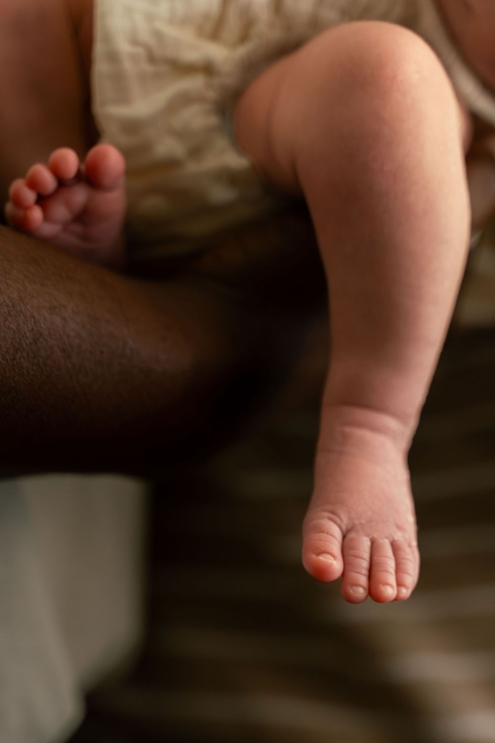 Newborn detail photo of baby's leg