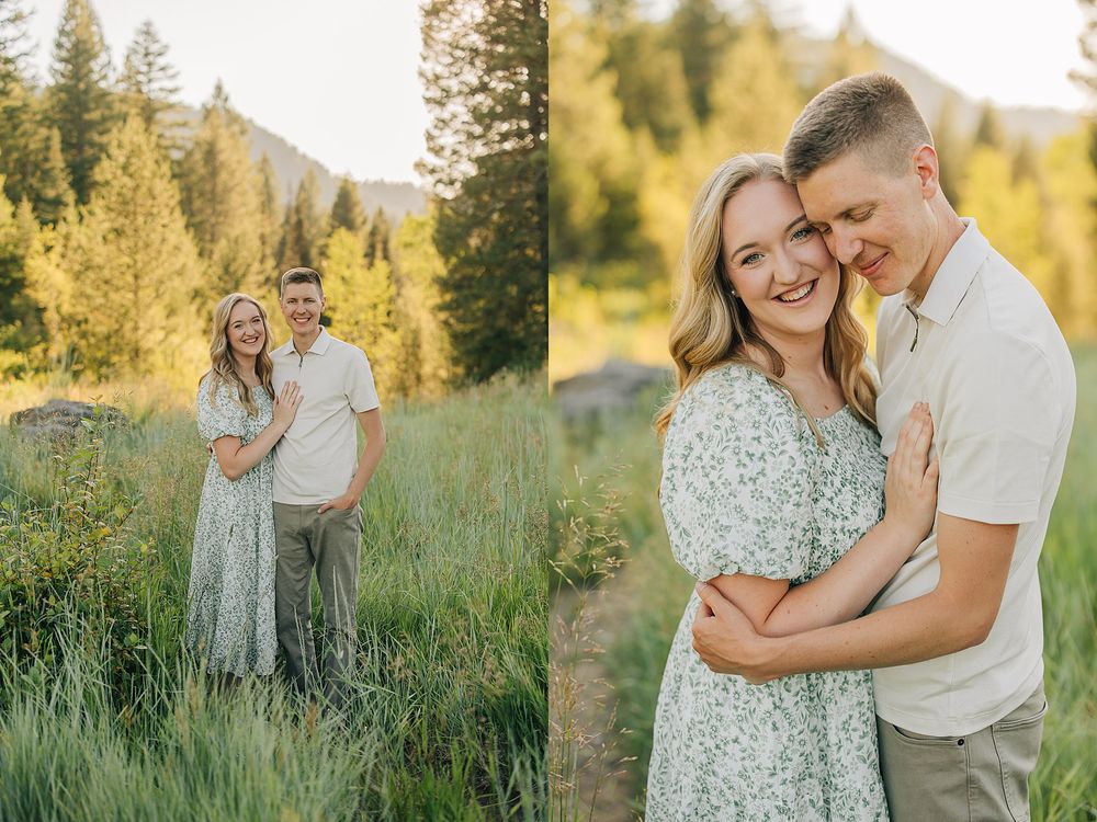 Couple embracing and smiling in a lush green meadow with golden trees and mountains during an outdoor engagement session.
