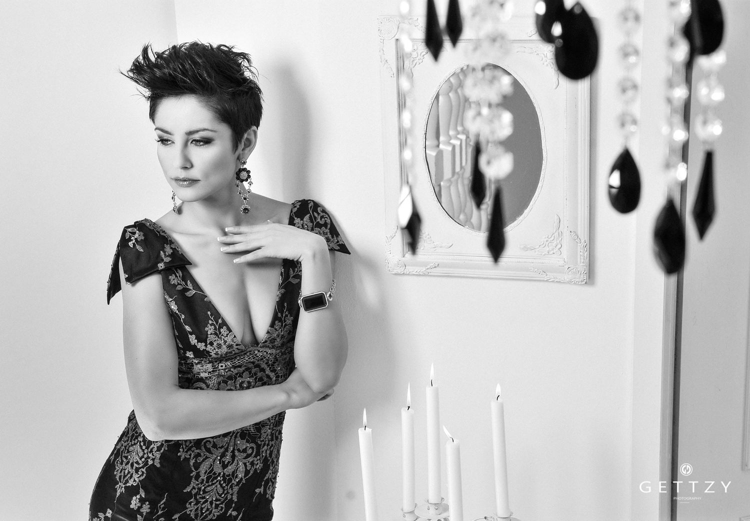 Black and white portrait  Antonia Stupar Jurkinwith elegant lace dress and candles creating dramatic ambiance zagreb