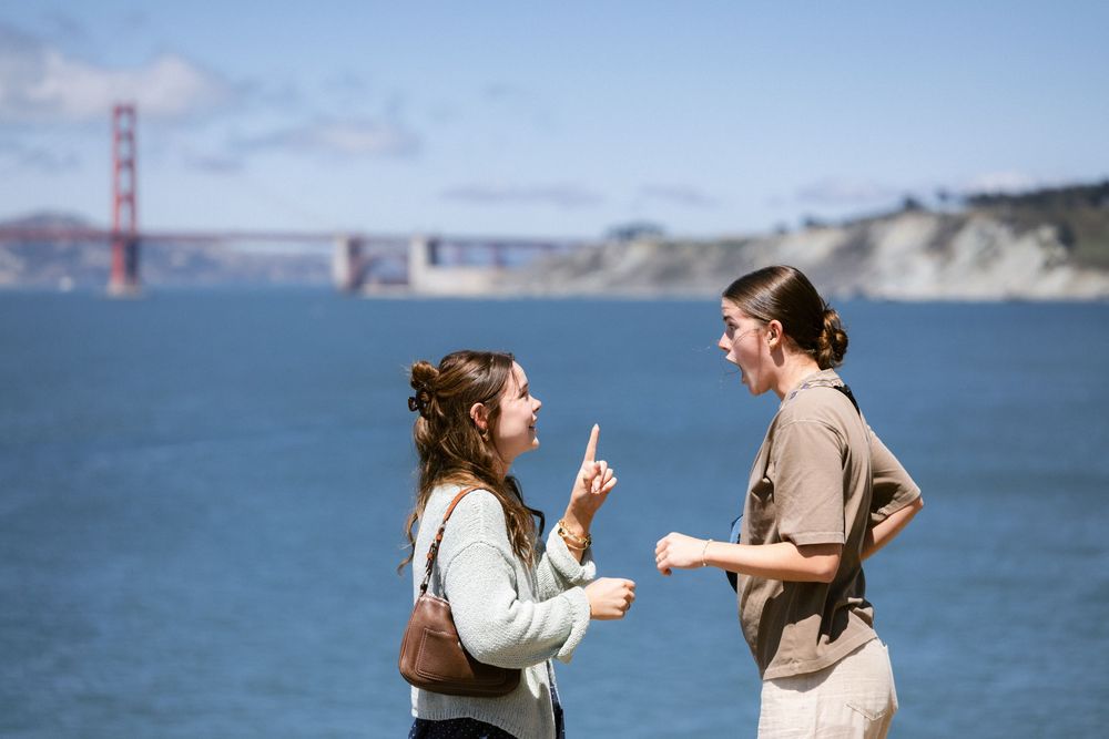Lesbian couple proposal overlooking the San Francisco coastline