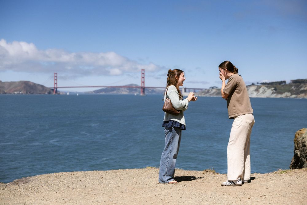 Lesbian couple proposal overlooking the San Francisco coastline