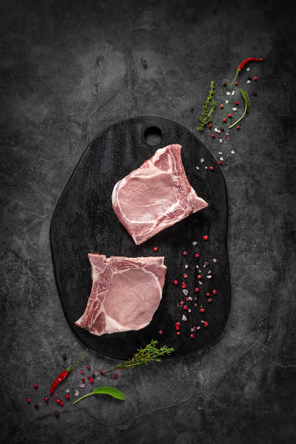 Mangalica T-bone steak by Fekete Zsóka in a moody dark flatlay, © Reka Peurala, Three Pod Studio