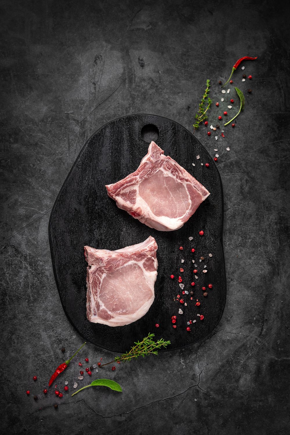 Mangalica T-bone steak with bacon by Fekete Zsóka in a moody dark flatlay, © Reka Peurala, Three Pod Studio