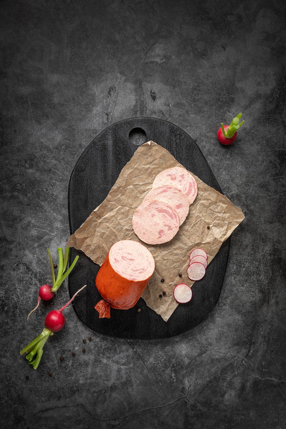 Mangalica párizsi by Fekete Zsóka in a moody dark flatlay with rustic wood and stone styling, © Reka Peurala, Three Pod Studio